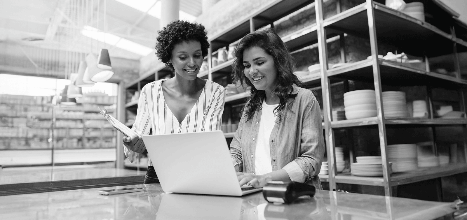 Business owner working with a treasury management specialist to simplify bank account management and liquidity.