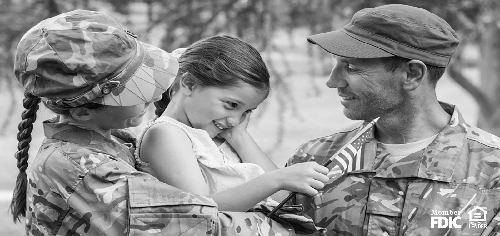 military personnel hug their daughter on Veteran's Day