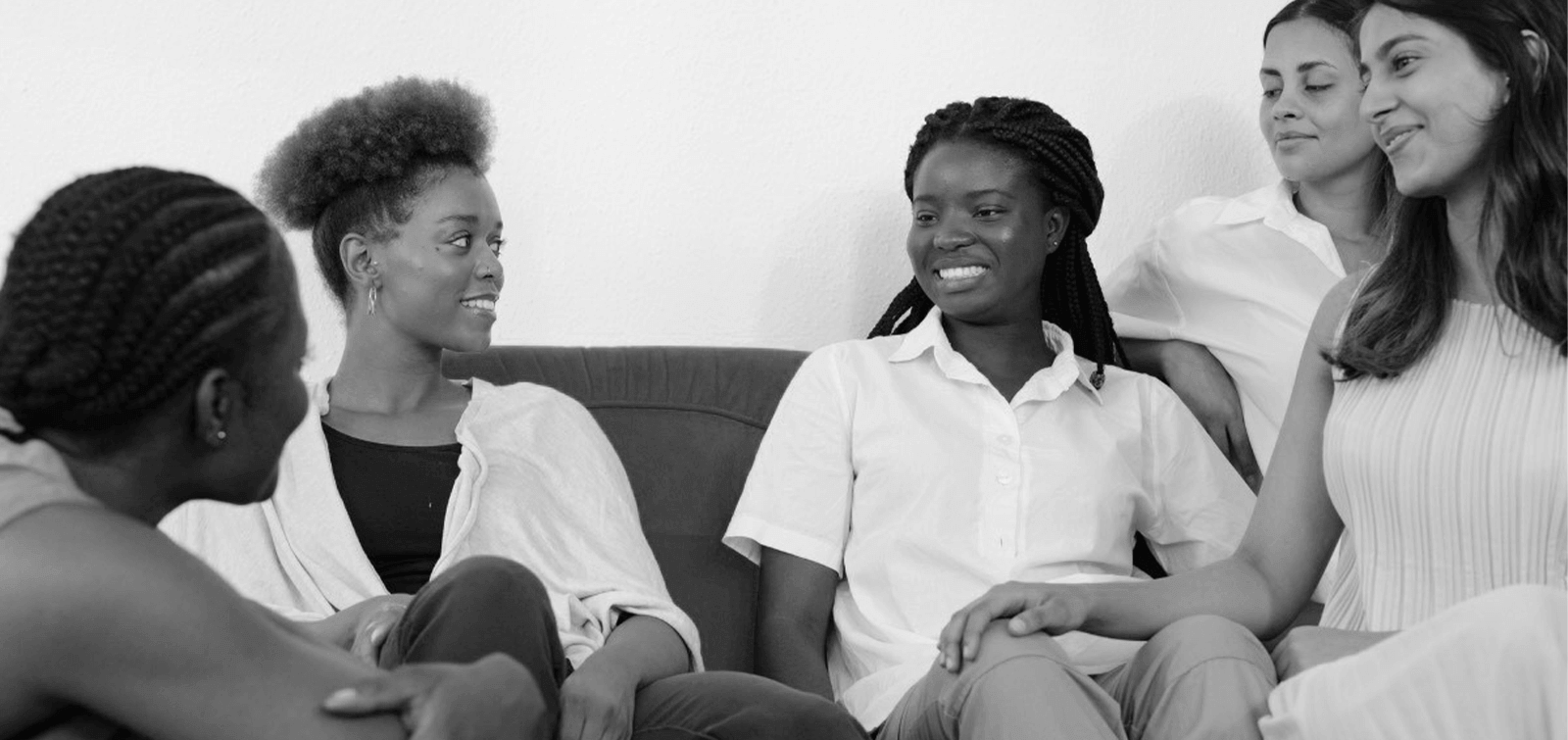a group of female coworkers discuss the importance of diversity