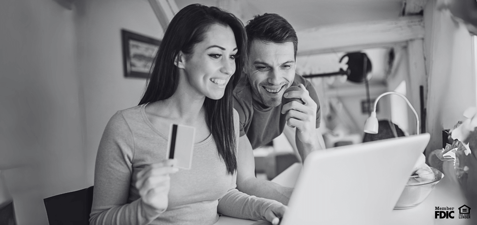 A man and woman sign up for a secured credit card.