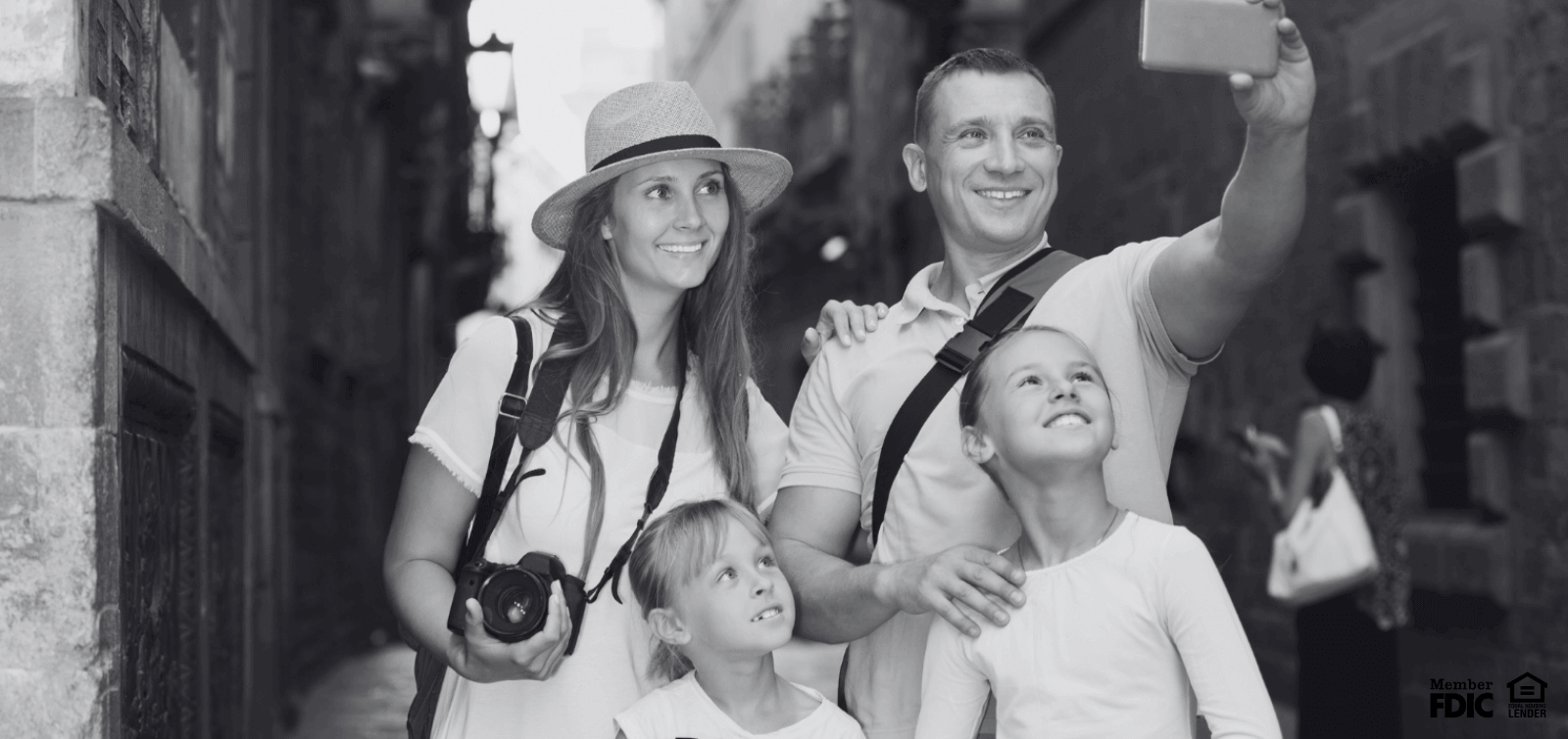A family takes a selfie while on vacation 
