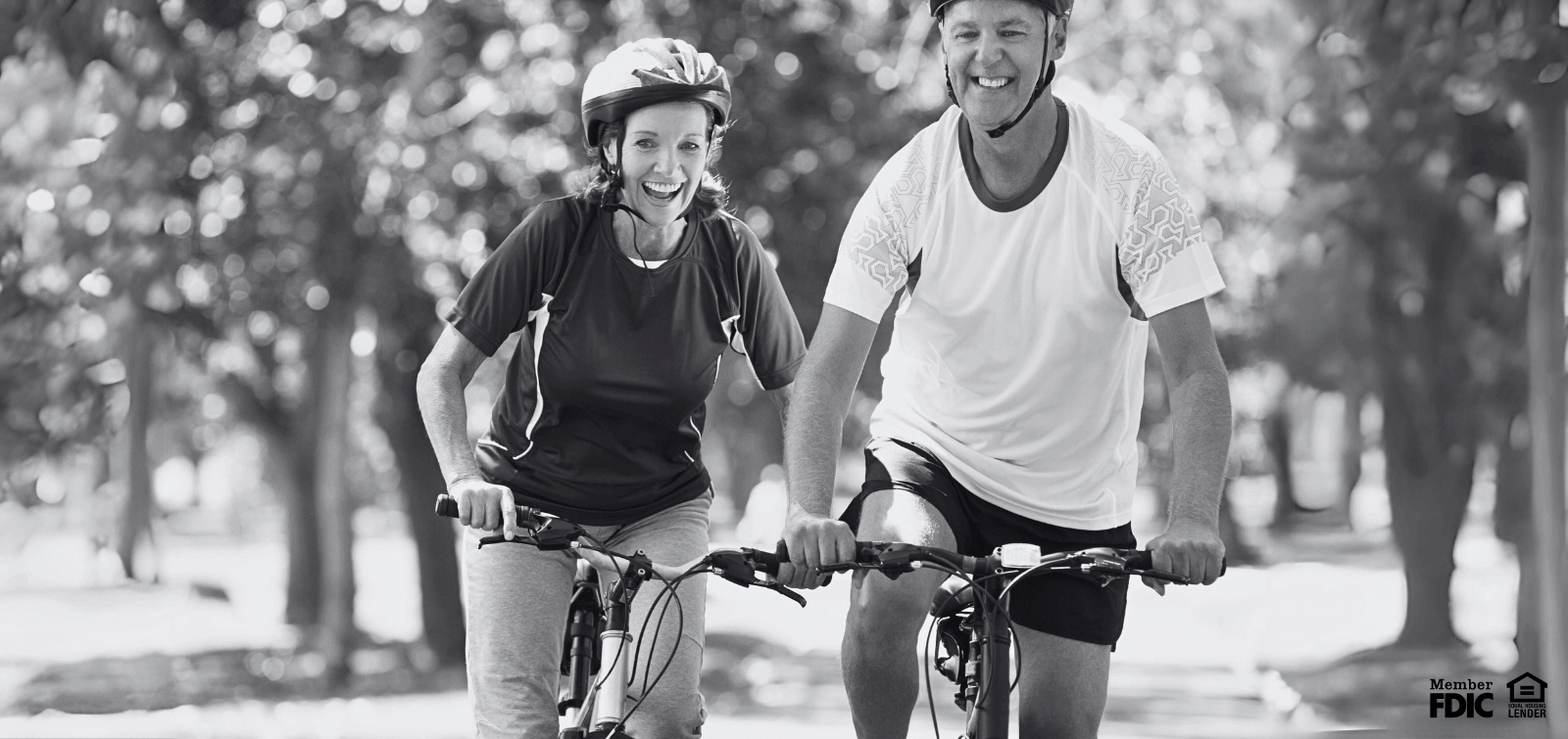 a couple who save for retirement with money market accounts goes for a bike ride in Leavenworth, KS.