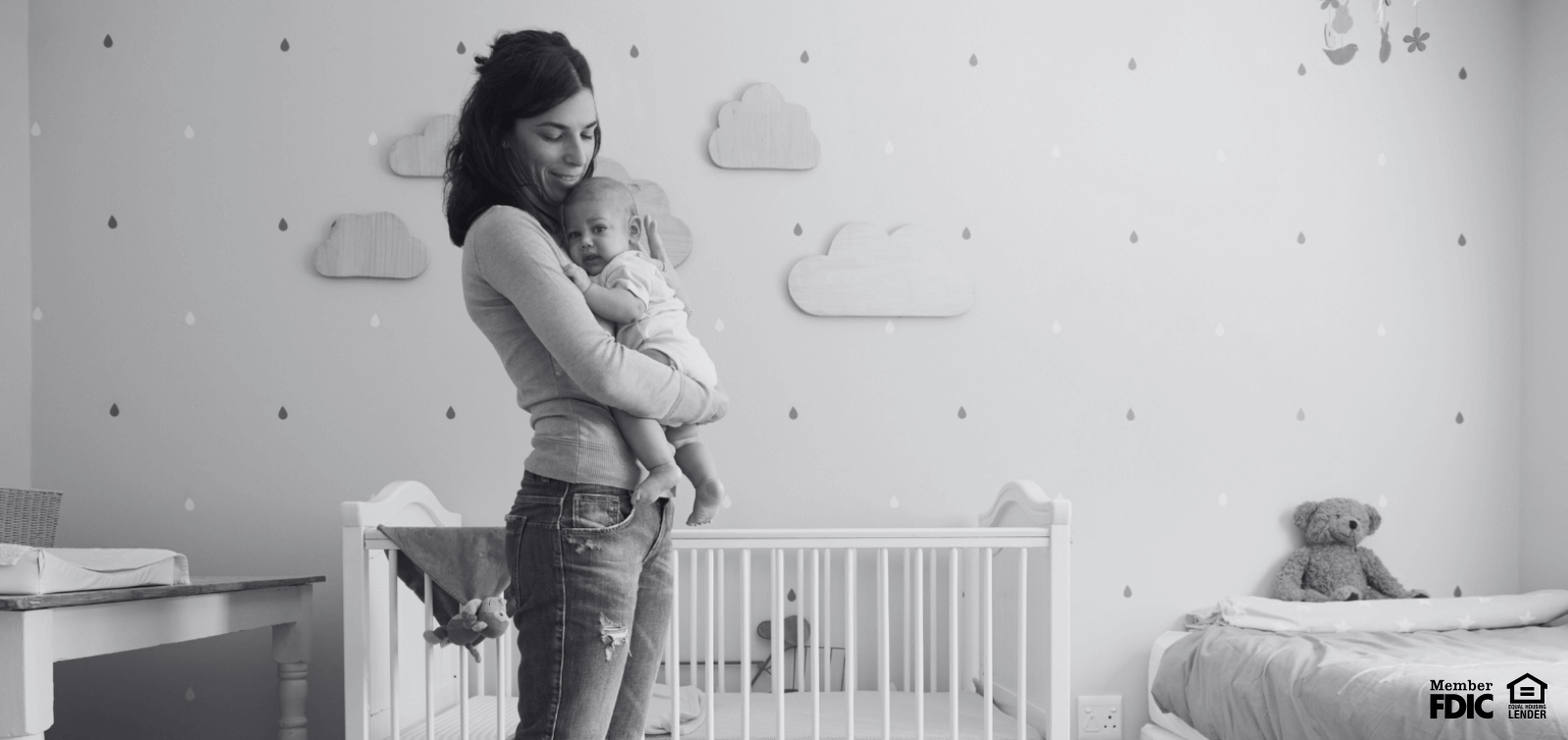 a mom holds her baby tight to her chest