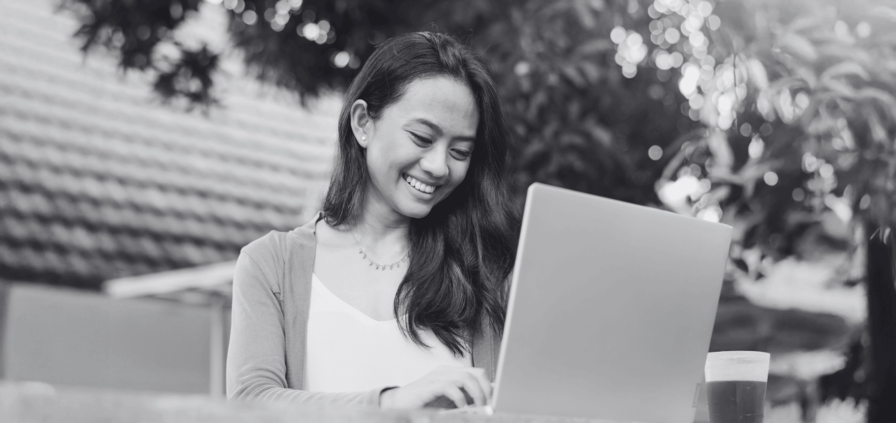 Woman comparing Experian vs. Equifax vs. TransUnion on her computer