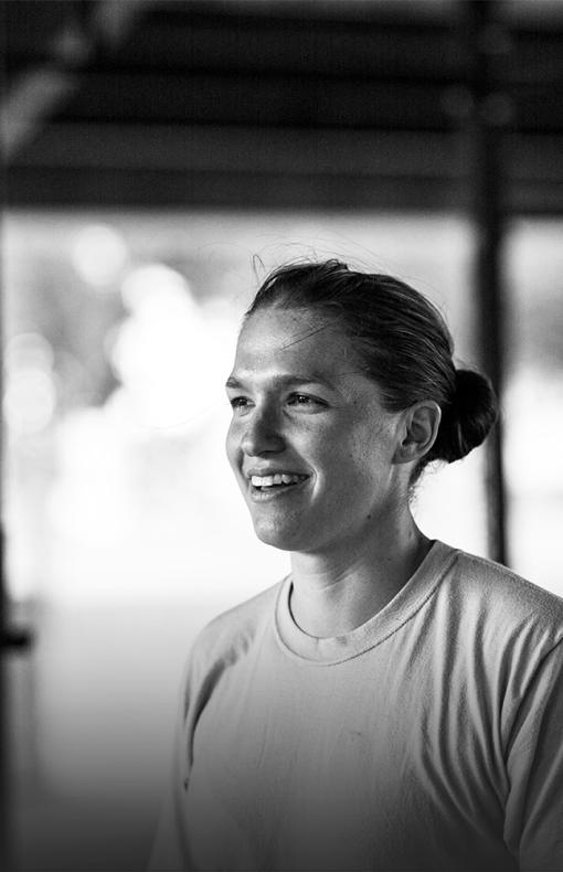 Women smiling in tee shirt outside