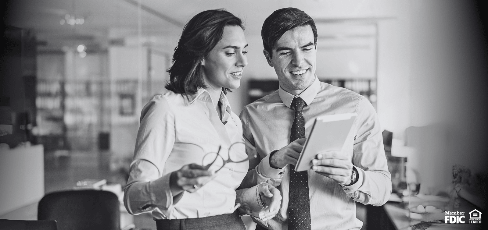 Two work colleagues benefitting from the best treasury management services/