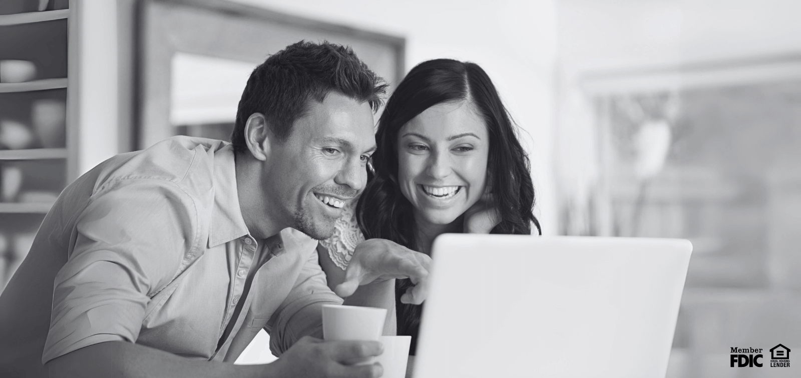 A couple researches the many different ways to diversify their investments.