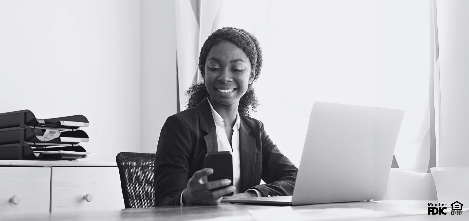 a business woman checks her business checking account through online banking