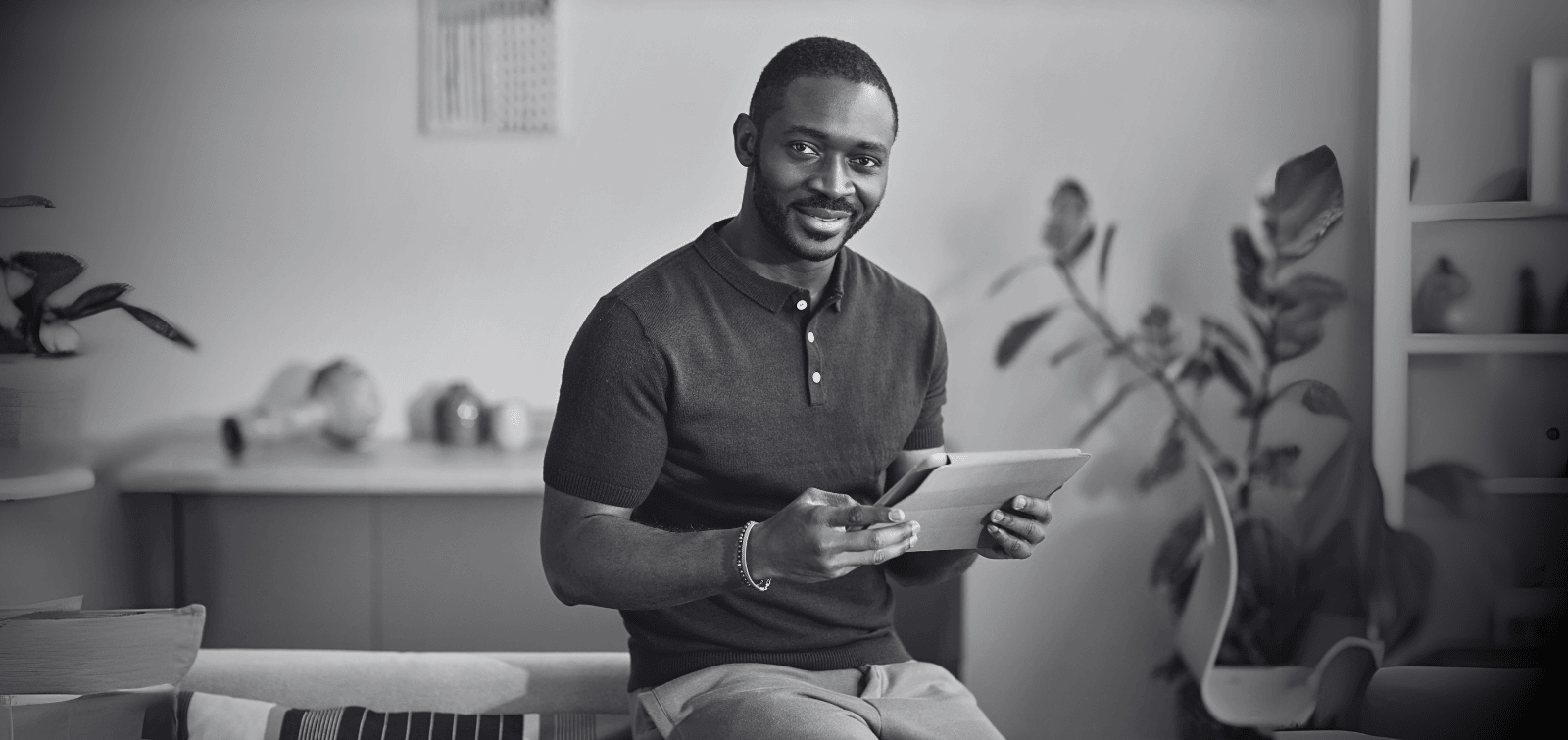 man reviewing list on tablet