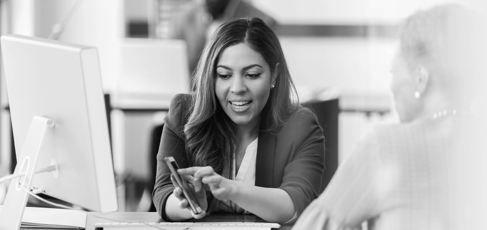 a banker shows her client how having multiple accounts can help you