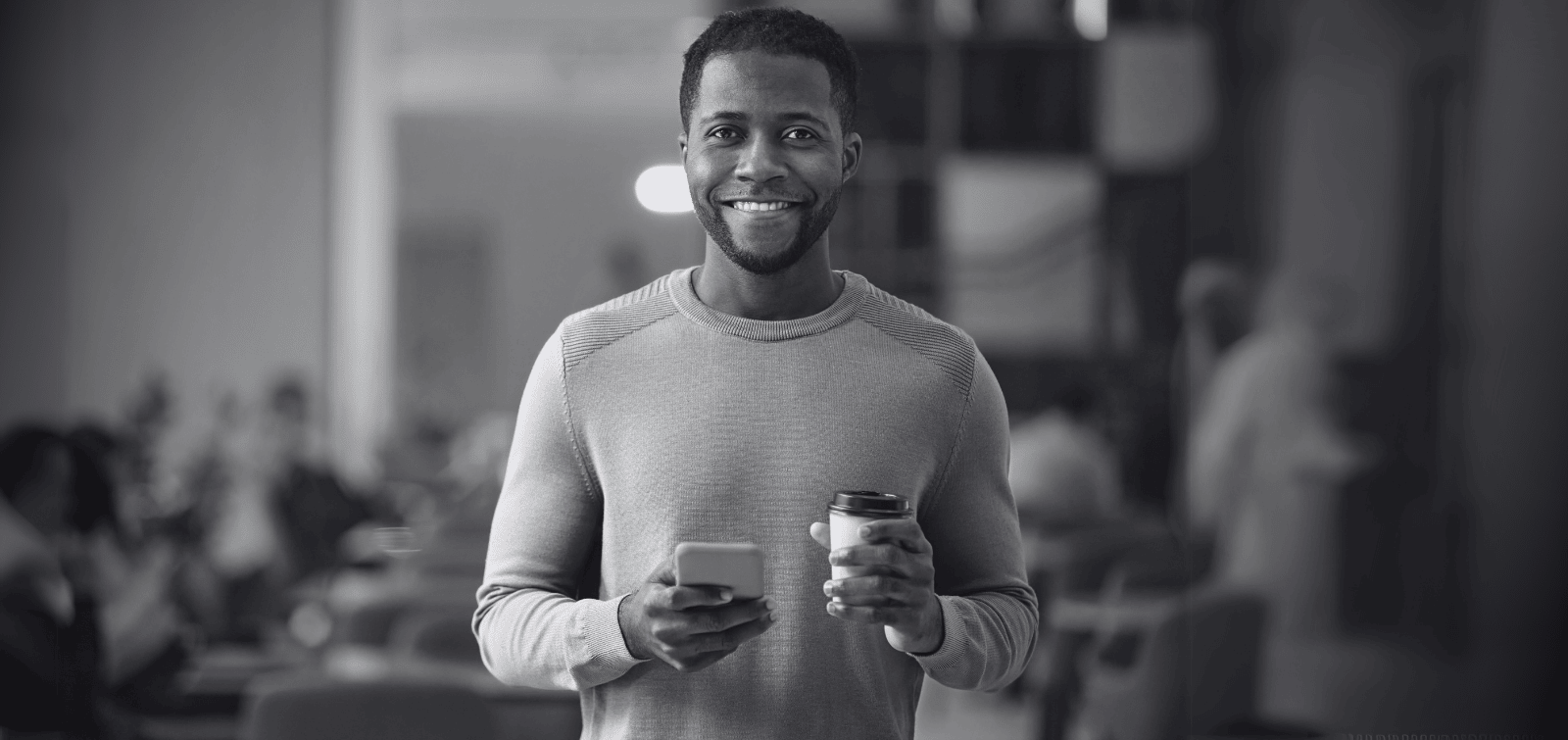 Male entrepreneur enjoying the benefits of picking the best business loan.